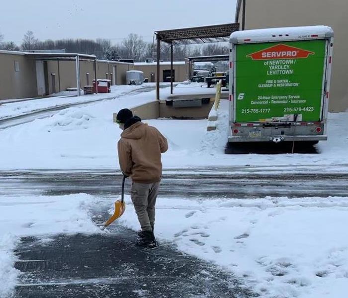 guy shoveling snow